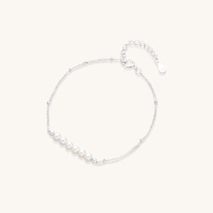 Gold-plated bracelet with alternating tiger’s eye stones and freshwater pearls, framed by pavé crystals—luxury private-label statement jewelry