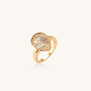 Teardrop-shaped gold ring with turquoise enamel floral filigree and pavé crystal inlay—ornate private-label fashion ring