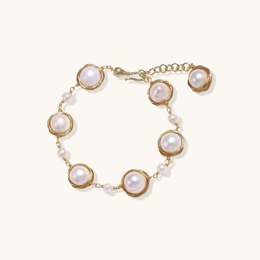 14K gold plated bracelet featuring wire-wrapped freshwater pearls in nest-like settings with adjustable chain closure