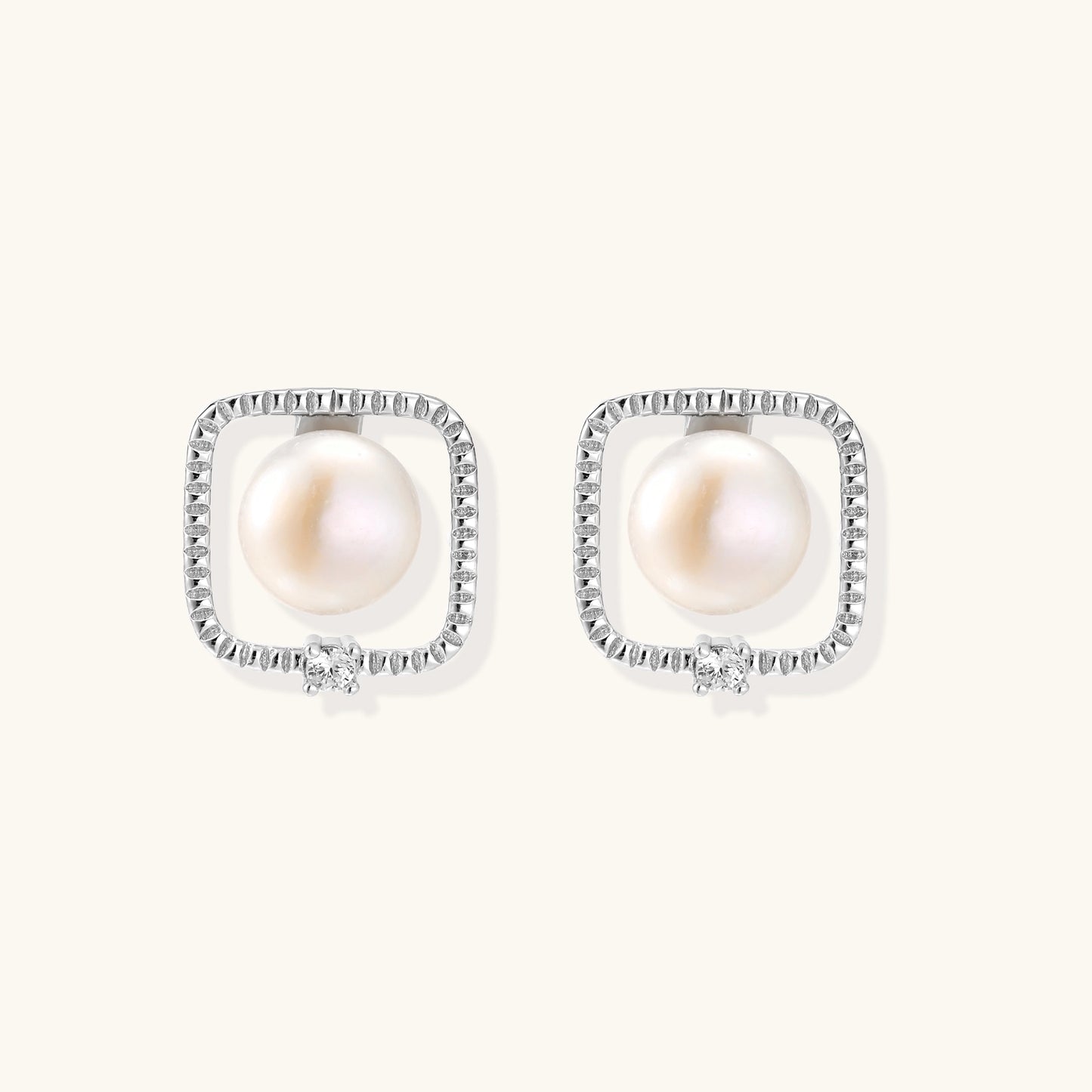 Square sterling silver stud earrings with freshwater pearls and crystal accents on white background.