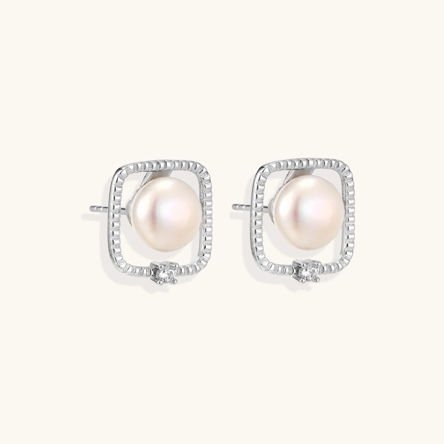 Square sterling silver stud earrings with freshwater pearls and crystal accents on white background.