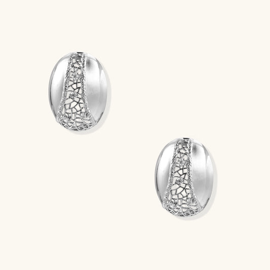 Oval gold-plated brass hoop earrings with cracked zirconia crystal pattern detail on neutral background.