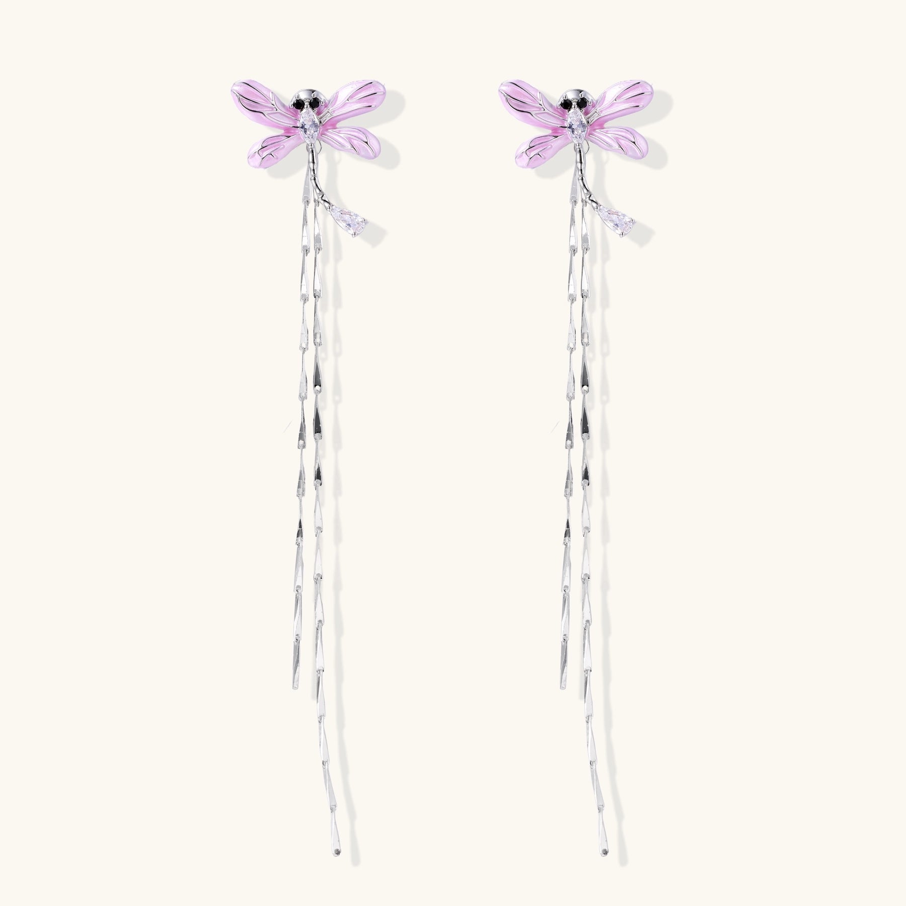 Long dangle earrings with purple dragonfly charms and crystal chains on white background, gold-plated finish.