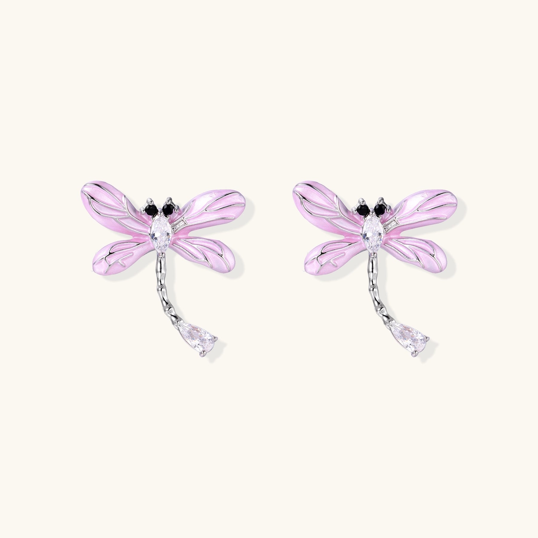 Long dangle earrings with purple dragonfly charms and crystal chains on white background, gold-plated finish.