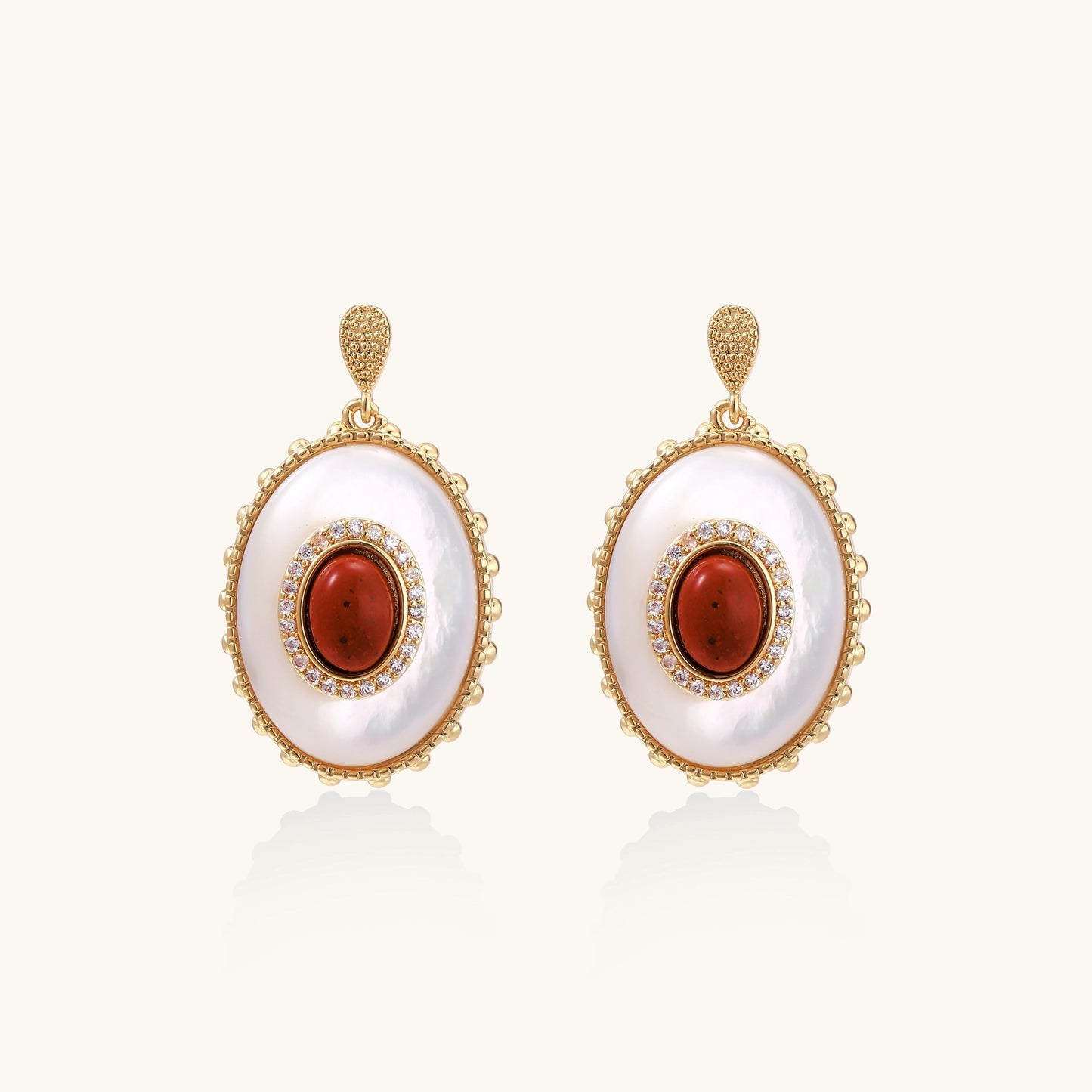Gold-plated drop earrings with layered oval mother-of-pearl and cognac gemstone center framed by crystal halo