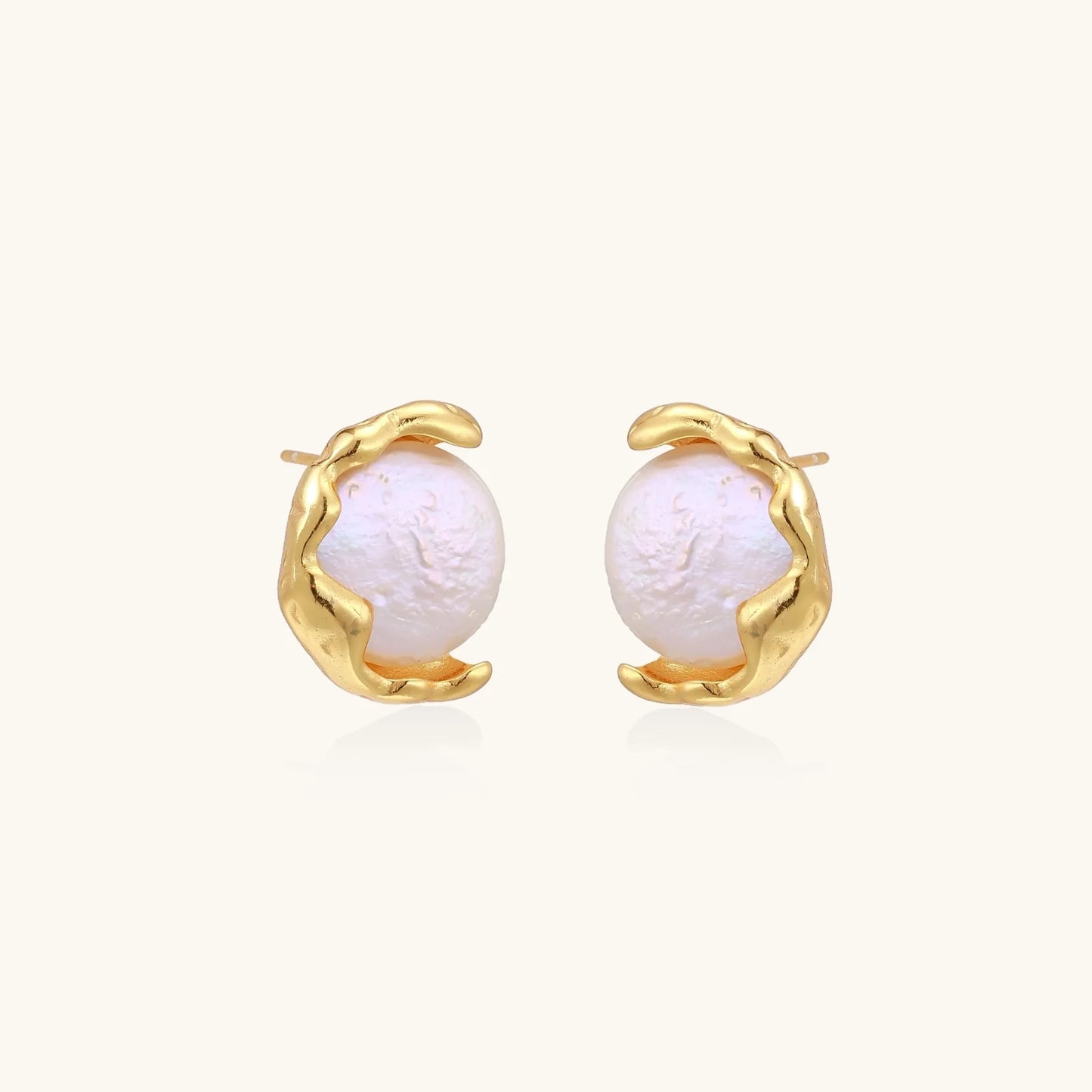 Gold vermeil studs with lustrous pink freshwater pearls in organic crescent settings