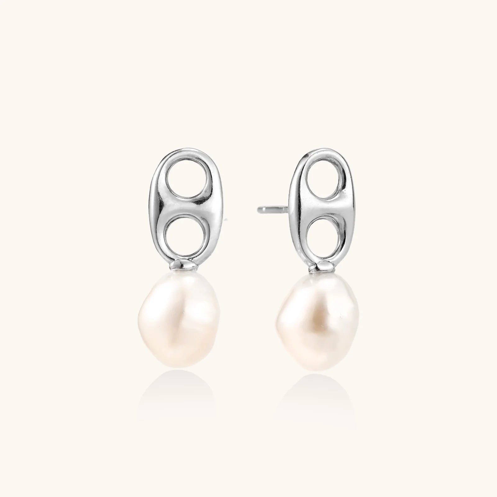 Modern rhodium-plated silver earrings with geometric double-circle design and freshwater pearl drops