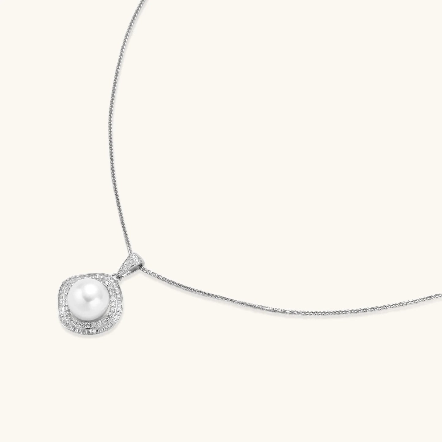 Cushion-shaped double halo pendant with 10mm freshwater pearl center on rhodium-plated sterling silver chain