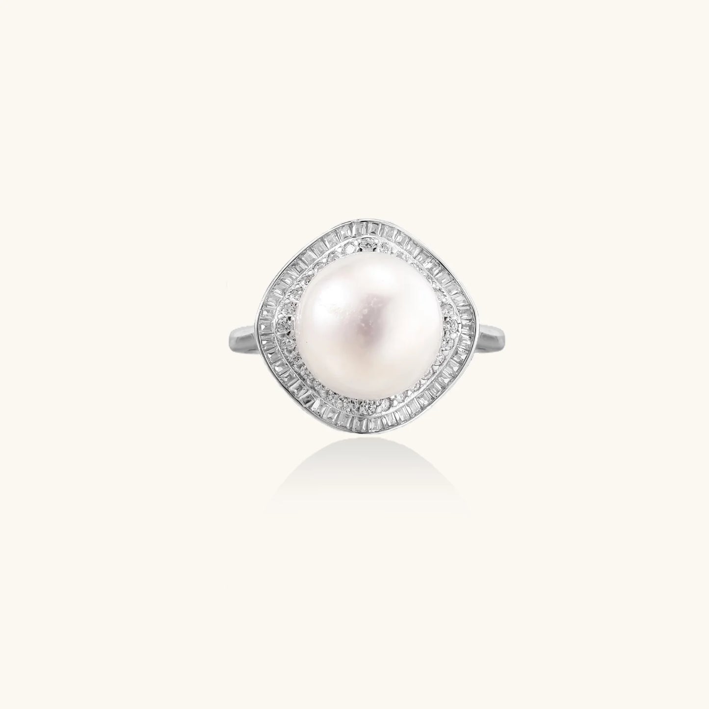 Rhodium-plated silver ring with round pearl center, double halo of baguette and round crystals forming cushion shape