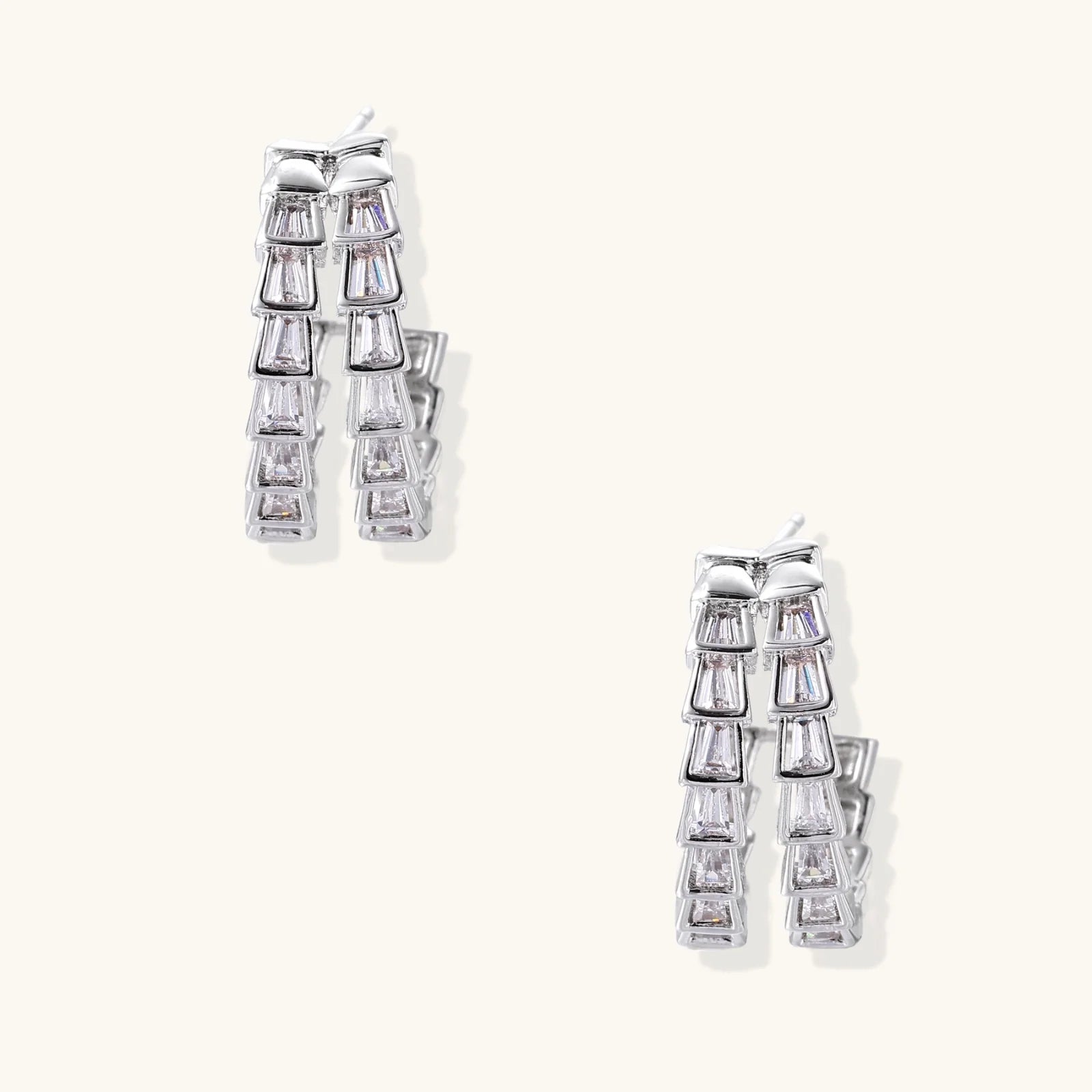 White gold-plated hoop earrings with double row of baguette-cut zirconia stones in geometric ladder design