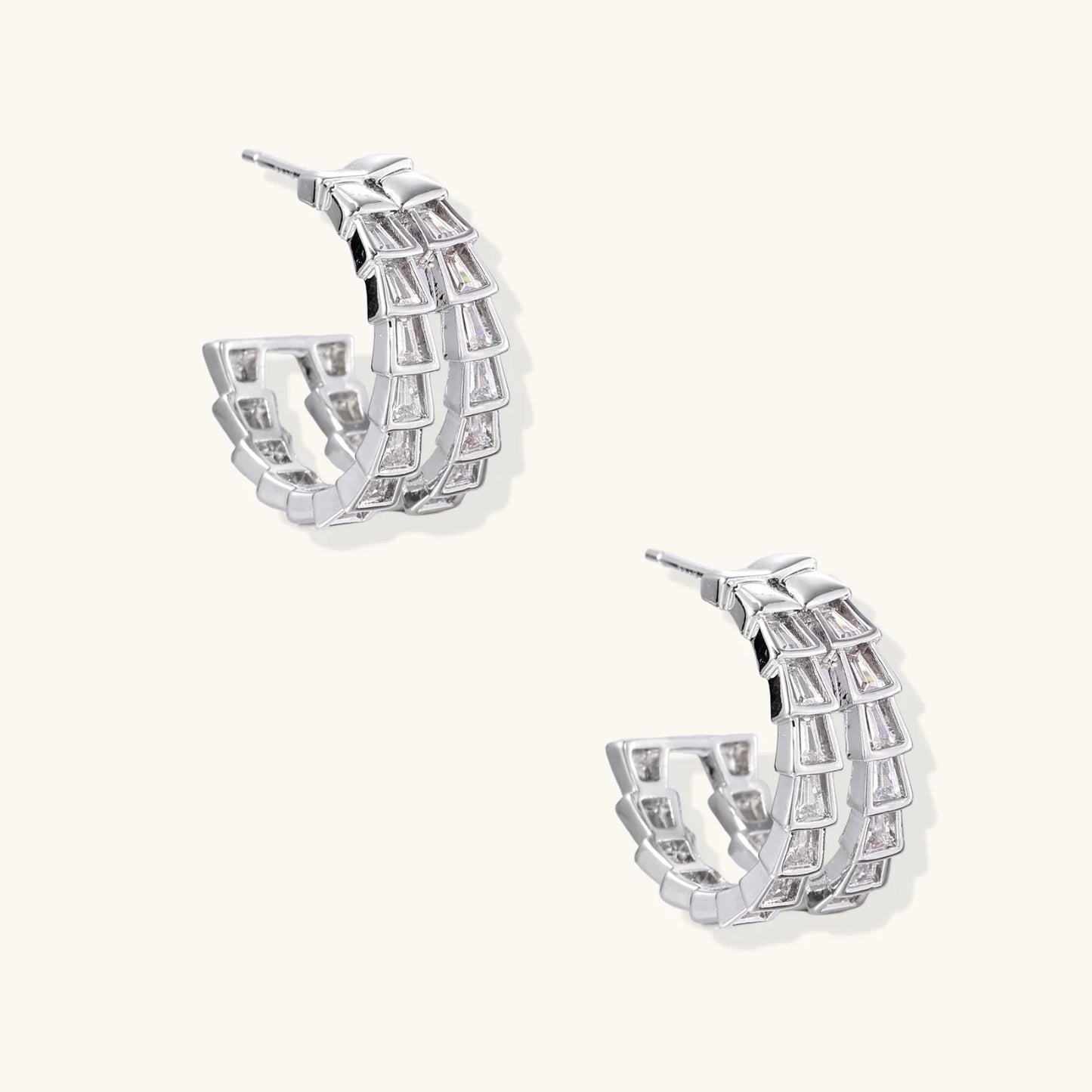 White gold-plated hoop earrings with double row of baguette-cut zirconia stones in geometric ladder design
