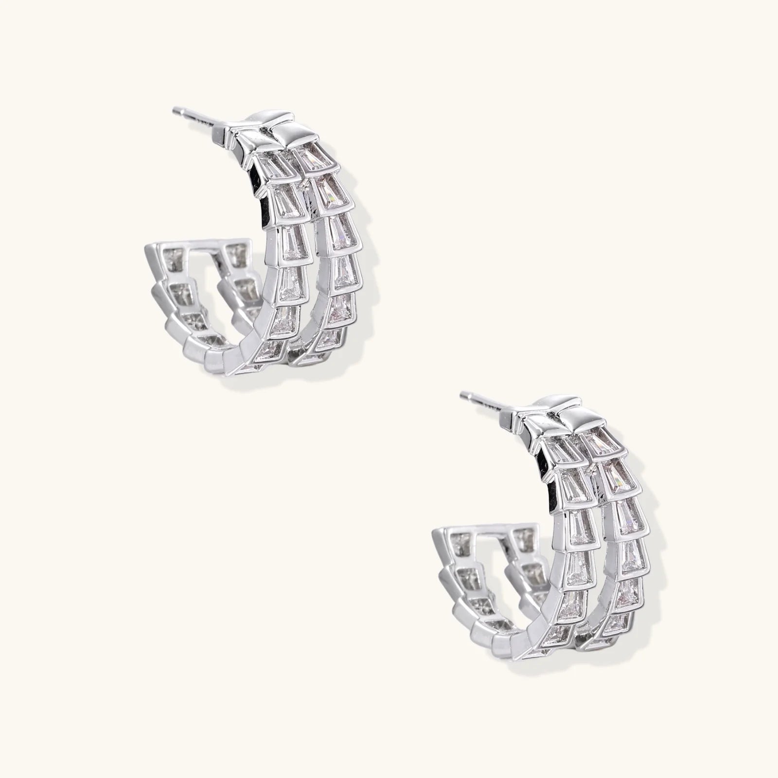 White gold-plated hoop earrings with double row of baguette-cut zirconia stones in geometric ladder design