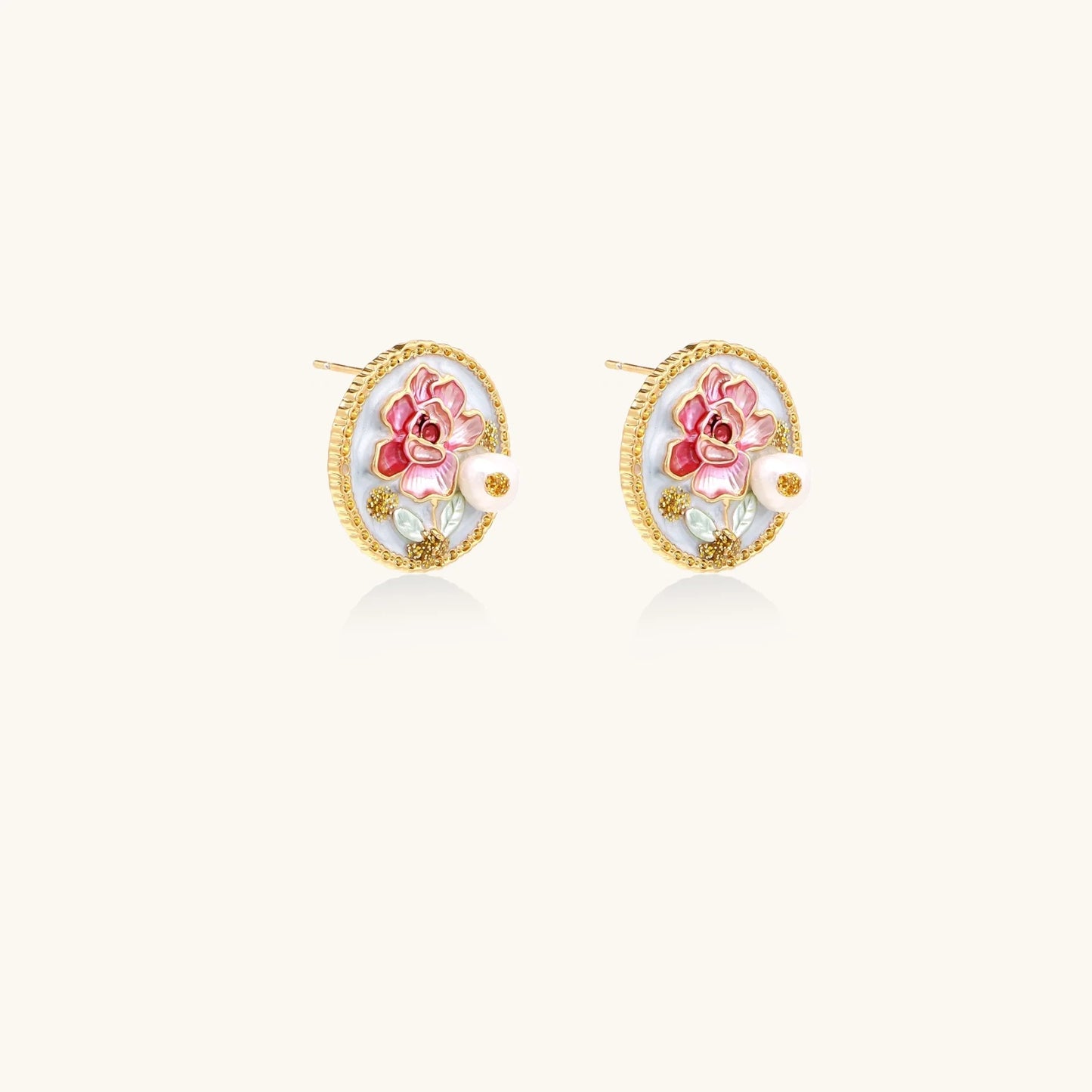 Gold-rimmed circular stud earrings with hand-painted pink peony enamel and pearl accents on white background