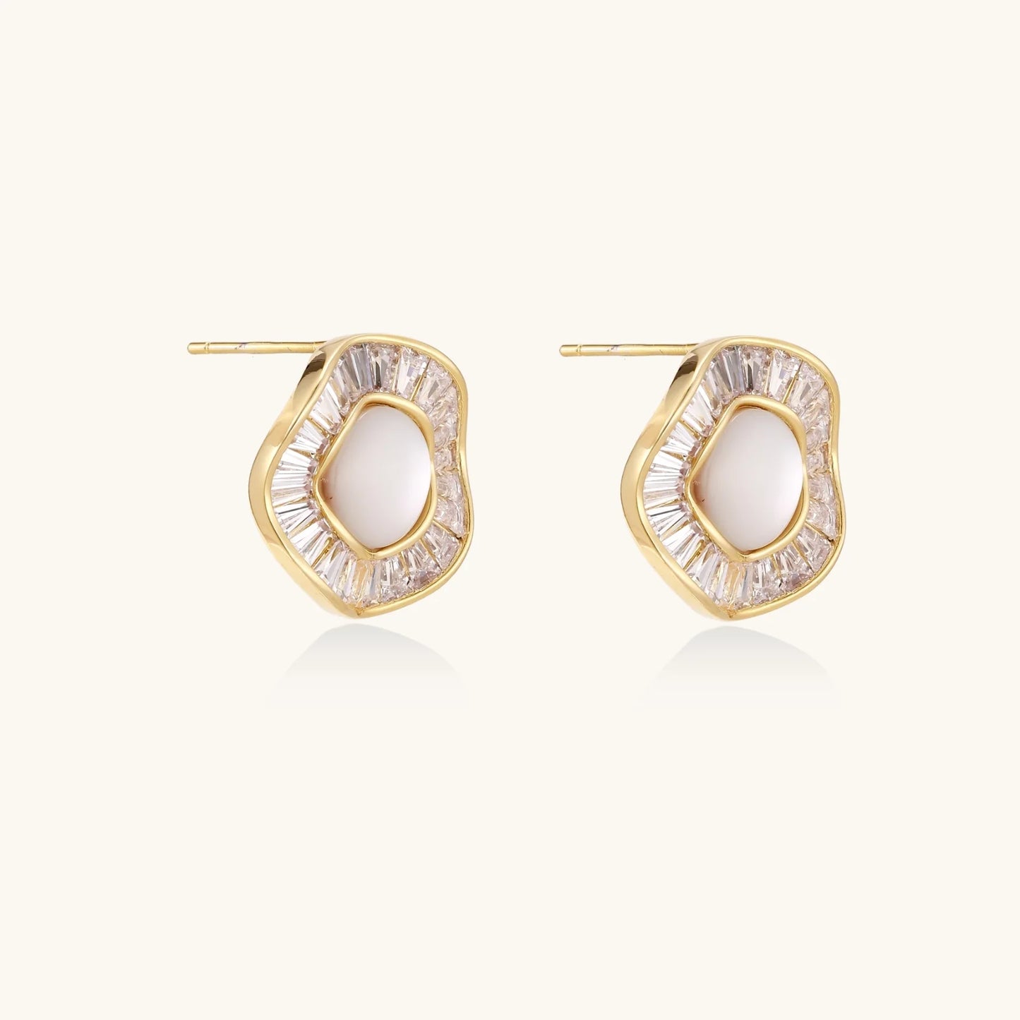 14K gold-plated stud earrings with freshwater pearl center surrounded by baguette-cut crystal halo in sunburst design