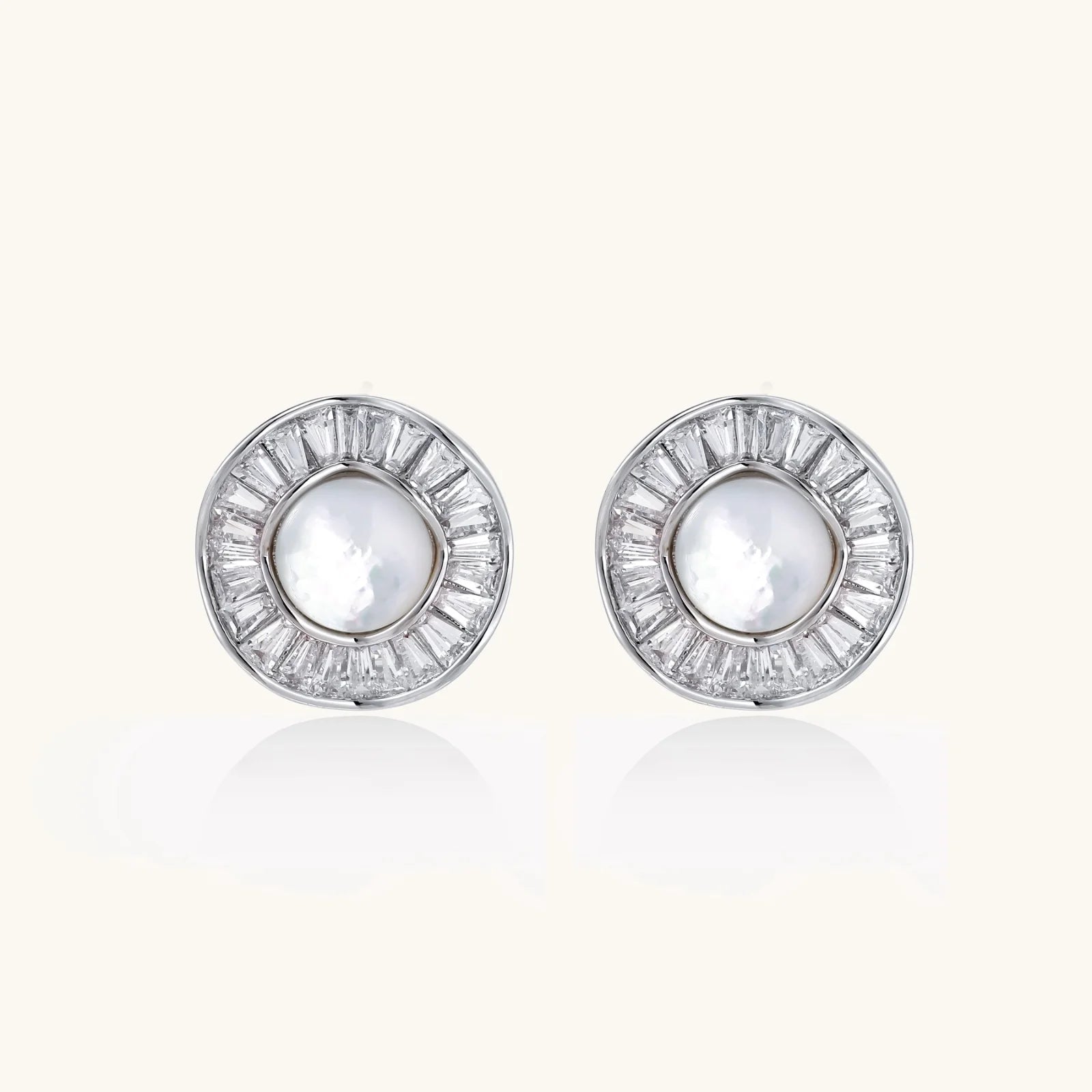 14K gold-plated stud earrings with freshwater pearl center surrounded by baguette-cut crystal halo in sunburst design