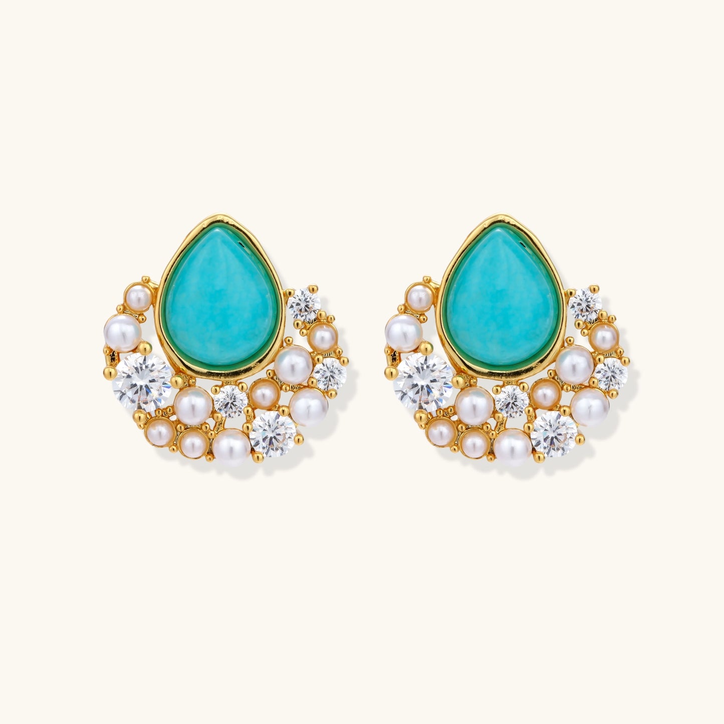 Gold-plated cluster earrings with teardrop turquoise stones surrounded by white pearls and clear crystals